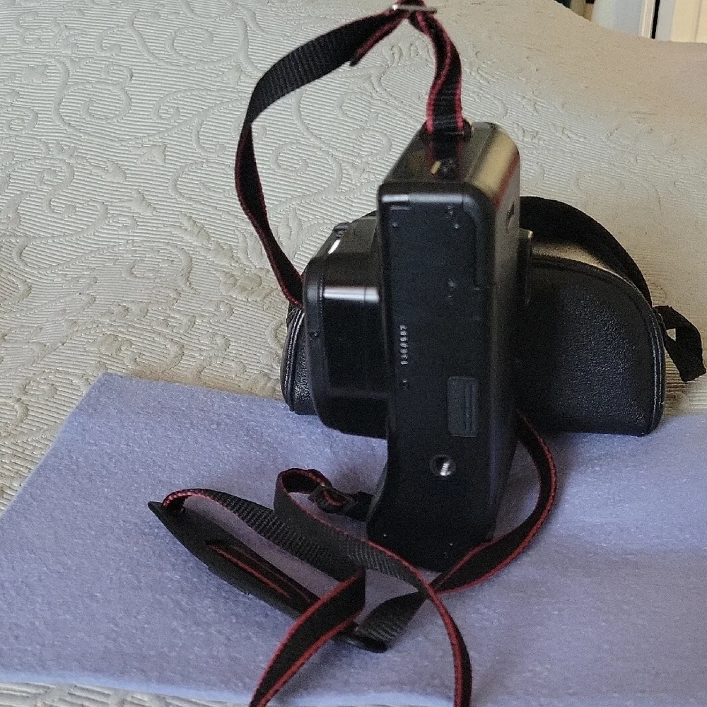 Canon Vintage Black Film Camera with Red Accents